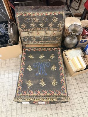 a chair that is sitting on the floor next to a box
