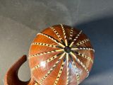 a wooden object that is sitting on a table