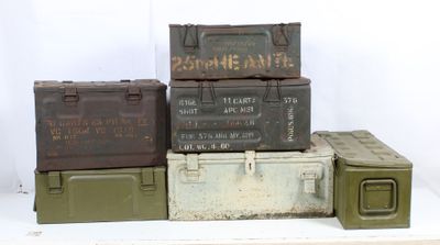 many different types of military boxes stacked on top of each other