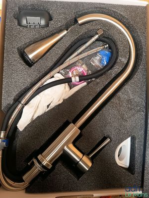 a picture of a kitchen faucet in a box