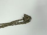 an image of a close up of a chain with a bird on it