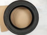 a close up of a tire on top of a cardboard box