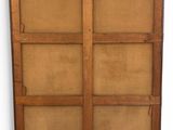an old wooden cabinet with two doors and a brown cloth cover