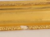 an image of a picture of a gold frame on a white surface
