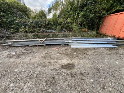 a pile of metal bars sitting in the middle of a yard