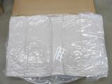 a box with a pair of white underwear wrapped in plastic