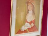 a picture of a woman in a red dress hanging on a wall