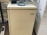 a small cabinet with a printer and a printer on it