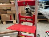 a red chair that is sitting in a room
