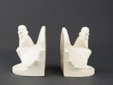pair of white ceramic bookends of a woman and a man