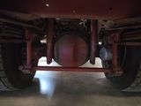 a close up of the front end of a red truck
