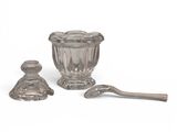an image of a glass bowl and spoon sitting next to each other