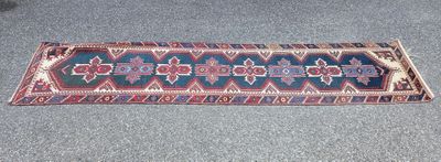 rug on the floor of a living room with a cat laying on the floor