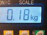 a digital scale that is on a counter top