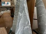 three stone cones sitting on a table in a room