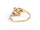 a close up of a gold ring on a white background