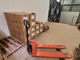 a pallet that is sitting on the floor next to some boxes