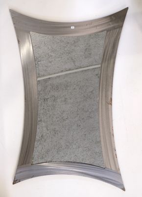 a mirror that is hanging on the wall in the bathroom