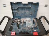 a tool cart with a drill and a hammer in it