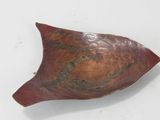 a red bowl with a brown and black design on it