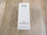 a bottle of balzicc sitting on a wooden table