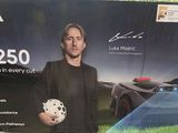 a man holding a soccer ball in front of a box