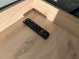 a remote control that is sitting on a table