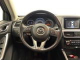 the interior of a car with a steering wheel and dashboard controls
