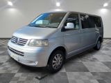 a picture of a silver van parked on a checkered floor