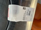 a receipt on the side of a washing machine that is sitting on the floor