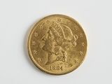 une image d'une pièce d'or sur une surface blanche