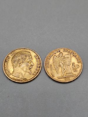 two gold sovereigns, one of which has a head of a man and the other of a woman