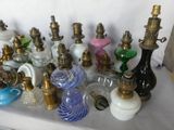 a lot of glass and brass items on a table