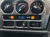 a close up of the controls on the dashboard of a car