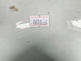 a close up of a white vase with a label on it