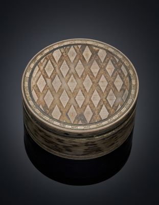 an image of a round wooden box with a pattern on it