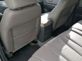 the interior of a car with two rows of seats and a center console