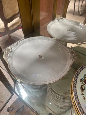 a glass display case with plates and plates on it