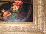 a picture of a painting of flowers in a gold frame