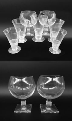 many different types of wine glasses on the table
