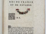 the front page of a book with a wreath of flowers on it