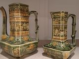 two vases that are sitting on a table