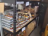 many jars of food on the shelves in the store