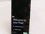the back of a black phone with a sign that says welcome to your pixel