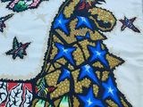 une photo d'une broderie au point de croix représentant une girafe