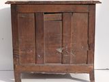 an old wooden cabinet with a door on it