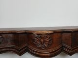 an antique console table with a carved wood top and two drawers