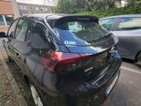 a black car parked on the side of the street