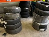 several tires are stacked on a shelf in a warehouse