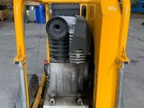 a close up of a machine on a pallet in a warehouse
